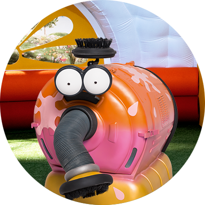 A cylinder shaped, orange and pink character with big white eyes and long, black nose.